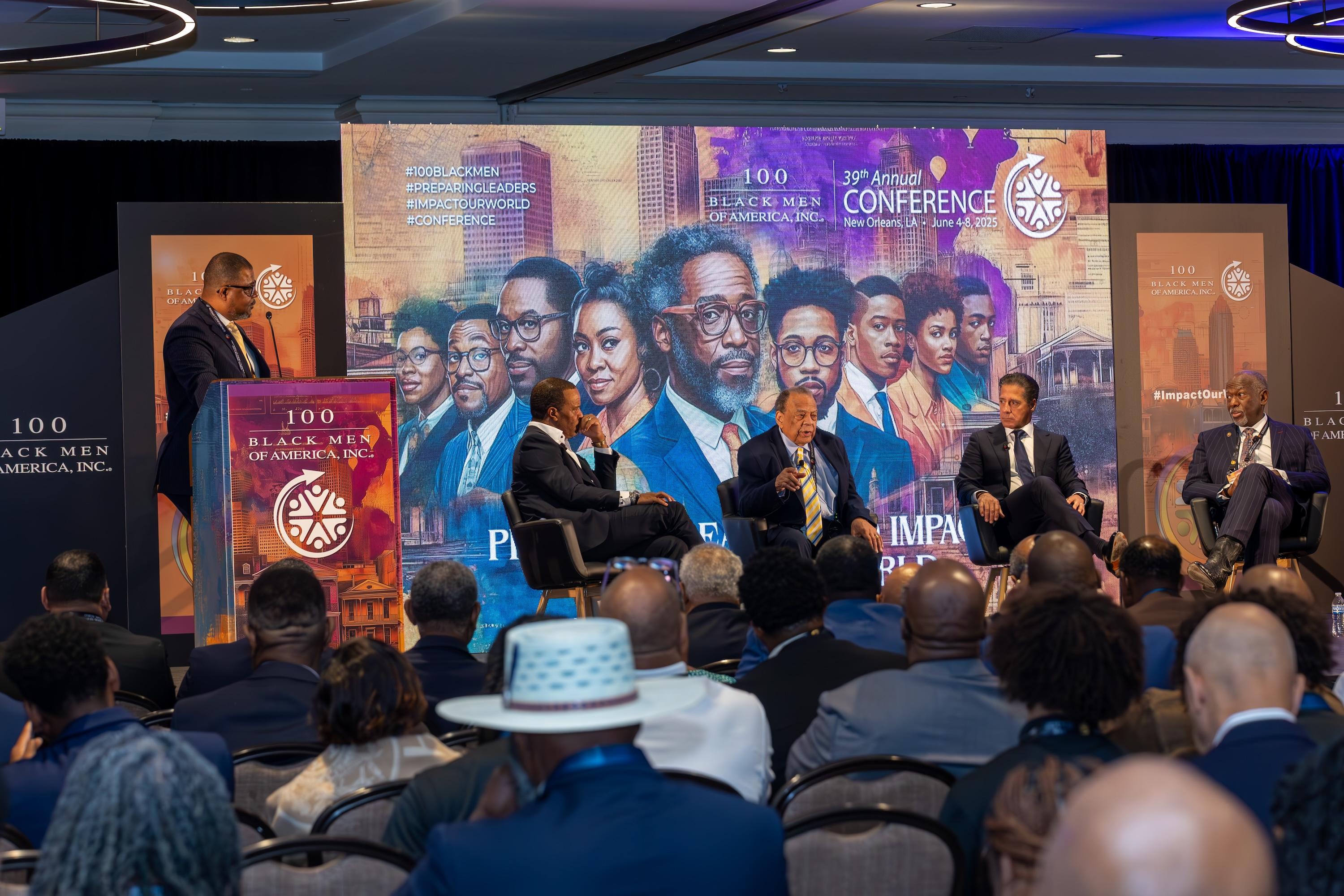 Panel discussion at national conference with audience seated in ballroom.